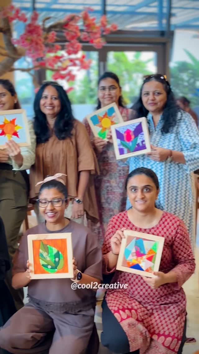 A group showing the colourful framed Kinusaiga artworks they made together